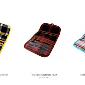 May include: Three open tartan sewing storage pouches in yellow/navy, brown/red, and blue/pink. Each pouch has multiple compartments with clear plastic windows and zippered closures. The pouches are designed to hold sewing supplies.