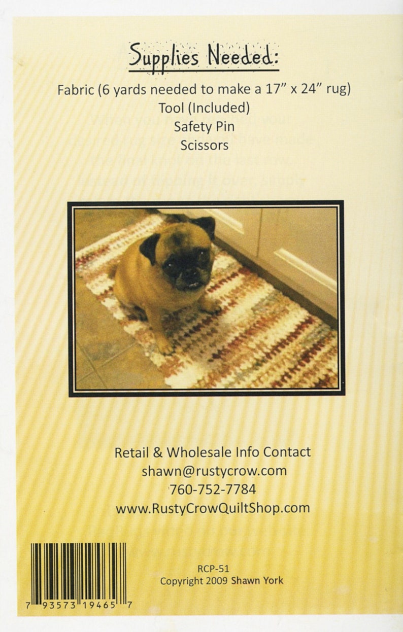 May include: A close-up of a brown and white rug with a pug dog sitting on it. The rug is made of braided fabric and has a striped pattern. The text "Supplies Needed: Fabric (6 yards needed to make a 17" x 24" rug) Tool (Included) Safety Pin Scissors" is printed on the back of the rug.