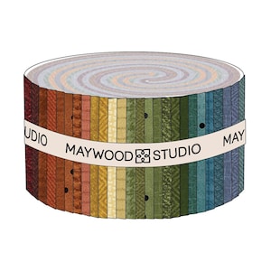May include: A roll of fabric featuring a variety of colors and patterns, including brown, orange, yellow, green, blue, and gray. The fabric is labeled "Maywood Studio".