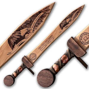 May include: Two wooden swords with dark wood pommels and leather-wrapped grips. The blades feature laser-engraved bald eagle imagery, the text "BRAVERY, INTEGRITY, FIDELITY," and "UNIT CHIEF, FEDERAL BUREAU OF INVESTIGATION, MARCH 31, 1996 - FEBRUARY 22, 2025."