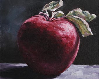 May include: A still life painting of a ripe red apple with green leaves. The apple is the focal point, rendered with textured brushstrokes. The background is dark, creating contrast. The painting is signed with the initials "mm".