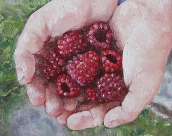 May include: A hand holding a handful of ripe red raspberries. The raspberries are arranged in a cluster, with some overlapping.