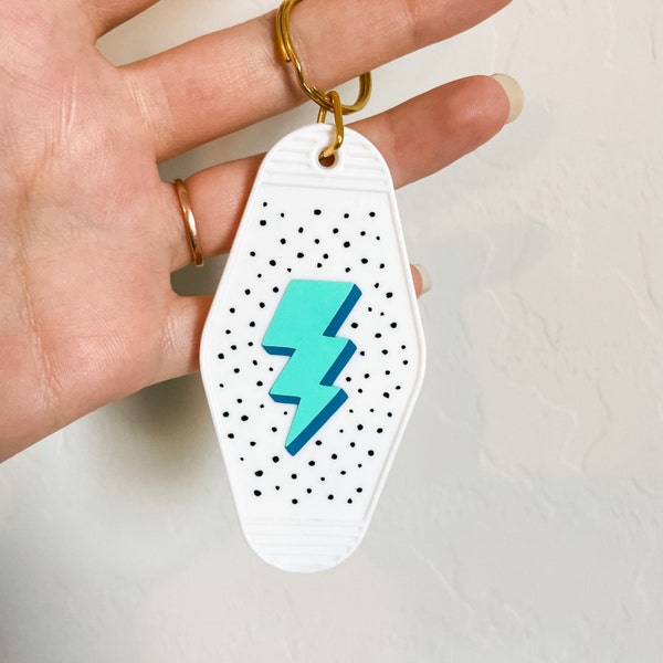 Retro Lightning Bolt Motel Keychain - White with Blue and Green Lightning Bolt and Black Speckles