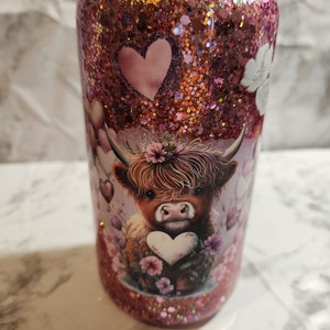 16 oz highland cow full wrap suspended flow snowglobe glitter tumbler. Straw included!
