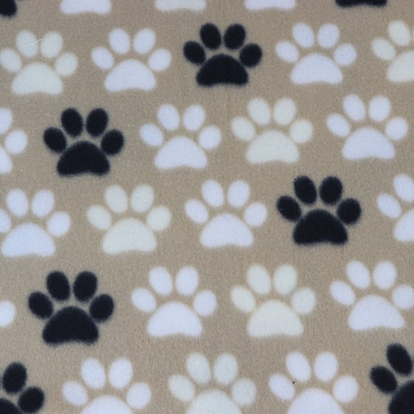 FABRIC PolarFleece, White/Black Paw Print on Tan, New/Unwashed, Continuous Cut, Sold in 1/4 yard increments, High Quality