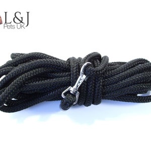 May include: A black rope dog lead with a silver clip. L&J Pets UK is printed on the label.