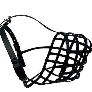 May include: Black leather dog muzzle with a basket-weave design. It has adjustable straps and a buckle closure. The design allows panting and drinking while preventing biting. The muzzle is made of leather.