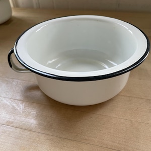 May include: A set of three ceramic mugs with a speckled, matte finish. The mugs are in shades of cream, light gray, and dark gray. Each mug has a simple, minimalist design, perfect for coffee or tea.
