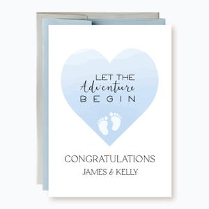May include: A blue and white watercolor heart with the text "Let the adventure begin" and two white footprints. The text "Congratulations James & Kelly" is below the heart.