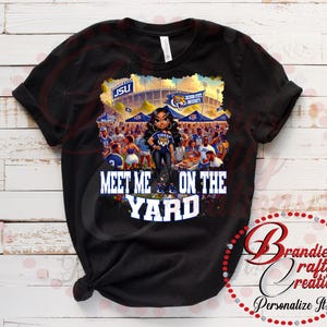 May include: Black t-shirt with a graphic of a woman in a football stadium with the text "Meet Me On The Yard".