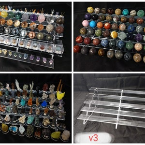May include: Four clear acrylic display stands with various sizes and configurations. The stands are filled with colorful, round, and irregularly shaped gemstones. The stands are perfect for displaying and organizing small collections of crystals, minerals, or other small objects.