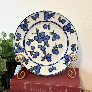 May include: A set of three ceramic nesting bowls in graduating sizes. The bowls are white with a textured, ridged exterior and a smooth interior. The largest bowl measures approximately 8 inches in diameter.