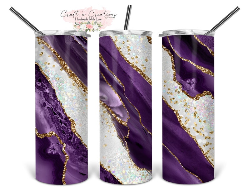 May include: Three stainless steel tumblers with a purple and gold agate design. The tumblers have a white background with a purple and gold agate pattern. The tumblers are all the same size and shape.
