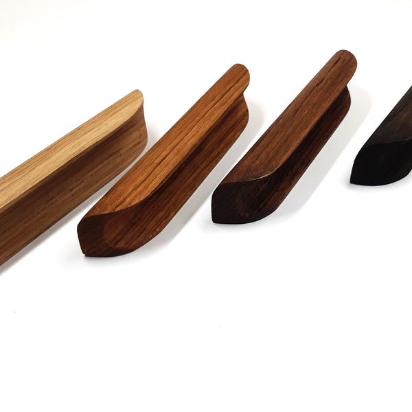Rounded handles, fashionable design, unique furniture handles, oak handles, comfortable handles, furniture handles, innovation in handles.