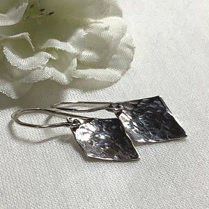 Silver textured diamond shaped drop earrings