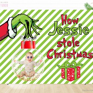 May include: A Christmas-themed backdrop featuring a green hand reaching for a red ornament with a baby inside. The text "How Jessie stole Christmas" is displayed in green and red. The background has diagonal green and white stripes.