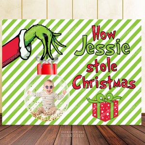 May include: A Christmas-themed poster with a green and white striped background. The poster features a baby inside a clear ornament, the Grinch's hand, a red gift box, and the text "How Jessie stole Christmas."