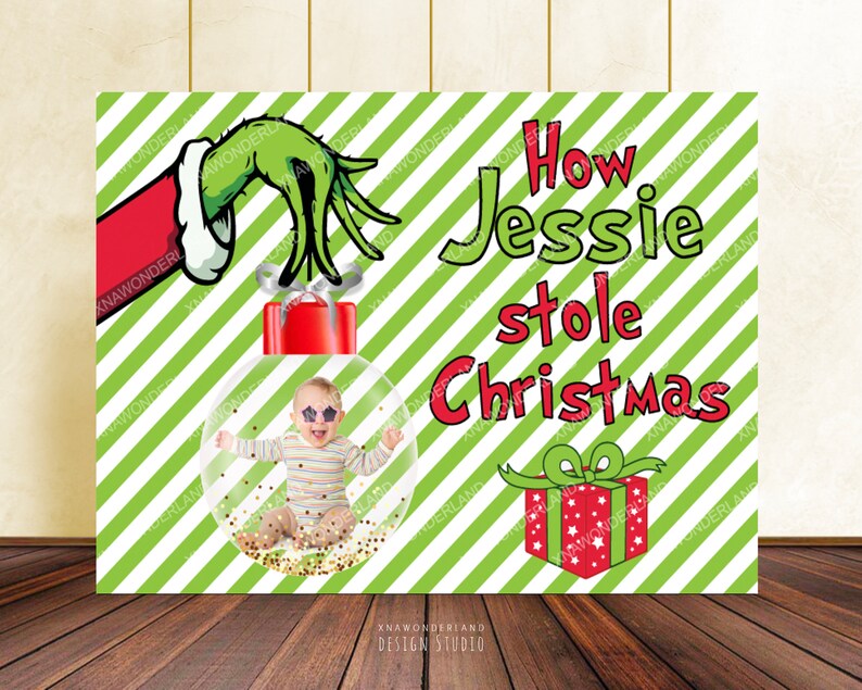 May include: A Christmas-themed poster with a green and white striped background. The poster features a baby inside a clear ornament, the Grinch's hand, a red gift box, and the text "How Jessie stole Christmas."