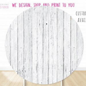 May include: White woodgrain backdrop for photography. The backdrop is a circle with a distressed white woodgrain pattern. The text "WE DESIGN, SHIP AND PRINT TO YOU" is at the top of the image. The text "CUSTOM SIZE AVAILABLE" is at the bottom right of the image.