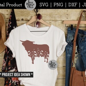 Floral highland cow silhouette shown on a white shirt with cowboy western gear.  Great for cutting in vinyl using silhouette or cricut.  SVG, JPEG, PNG, and DXF file types available