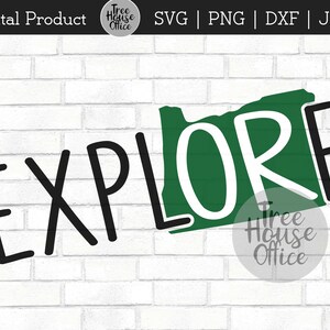 May include: A digital download of a green outline of the state of Oregon with the word "EXPLORE" in black text. The text is in a bold, handwritten style. The image is on a white brick background.