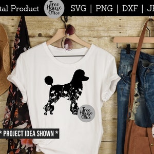 Floral poodle dog silhouette with flowers shown on a womens white shirt with country or western clothing around it.  design features a standard poodle with flowers inside the silhouette