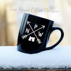PNW with arrows and Oregon state silhouette shown as a decal on a mug