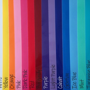 May include: A color palette featuring vertical strips of various colors, including black, white, yellow, orange, pink, red, purple, and green. Each color is labeled with its name in white text. The palette showcases a range of hues, from light to dark shades.