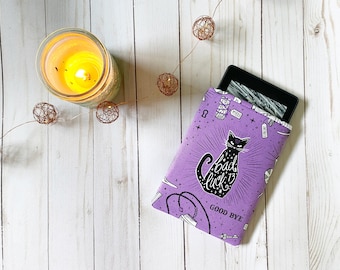 May include: Purple e-reader cover with a black cat illustration and the text "Bad Luck 13" and "Good Bye".