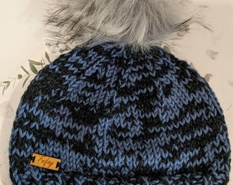 Knitted toque with faux fur pompoms