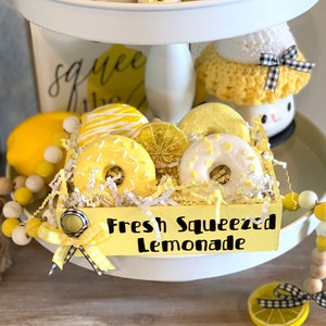 Fake lemon donuts. Tier tray decor