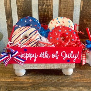 Fake Fourth of July donuts. Crate of donuts. Patriotic donuts. fake food