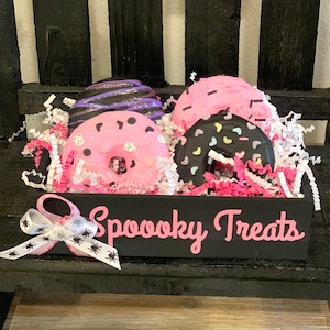 Fake Halloween Donuts. Faux donuts in crate. Spooky treats