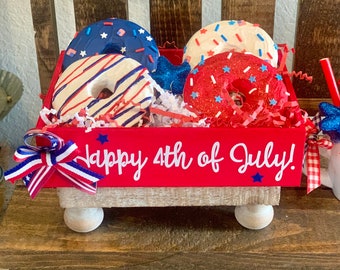Fake Fourth of July donuts. Crate of donuts. Patriotic donuts. fake food