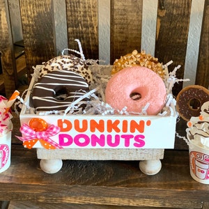 Fake donuts. Fake Donuts in wood tray. Faux food