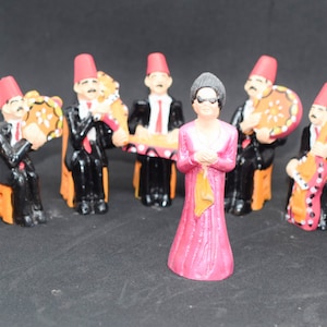 Egyptian om Kulthoum and her band pottery statues.