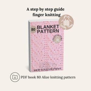 May include: A pink and white book cover with the title "80 Blanket Pattern" and the words "Finger Knitting" in a circle. The cover features a close-up of a pink knitted blanket with a diamond pattern. The book is for sale at Shop LovelyHomeam.