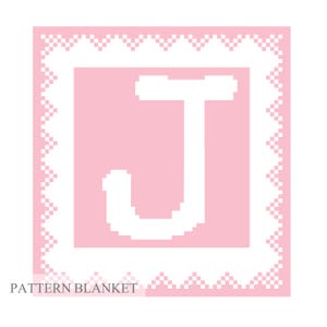 May include: A pink and white crochet blanket with a white letter J in the center. The blanket has a white border with a scalloped edge.