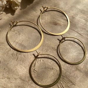 Hammered brass hoop earrings, boho style, understated // Gold and silver earrings, designer jewelry, modern shape, antique