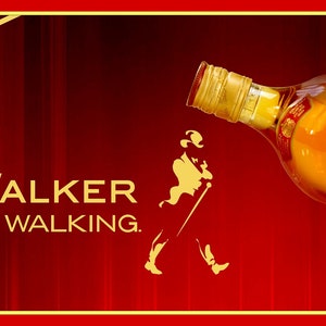 May include: A red and gold Johnnie Walker Red Label Scotch Whisky bottle with the slogan "Keep Walking." The bottle is tilted and the label is visible.