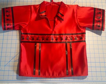 May include: Red satin shirt with black trim and handprint designs. The shirt has a collar and a V-neck.