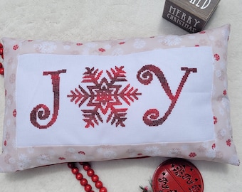 Patrón de punto de cruz navideño con copos de nieve de alegría en formato PDF diseñado por Angela Koyles en From Dusk to Dawn Designs