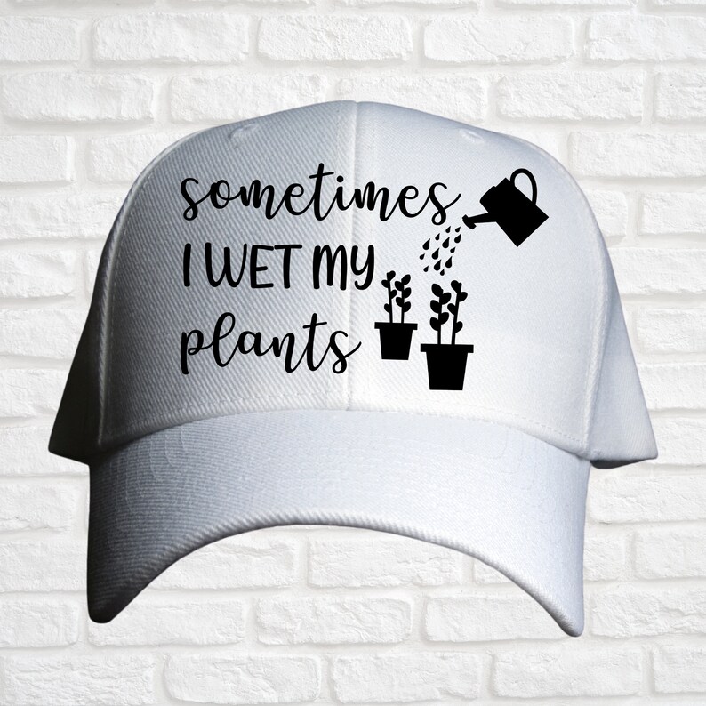 May include: White baseball cap with black text that reads "sometimes I WET my plants" and a black silhouette of a watering can pouring water on two potted plants.