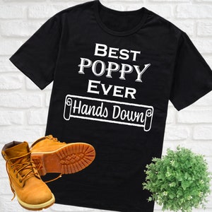 May include: Black t-shirt with white text that reads "Best Poppy Ever Hands Down".