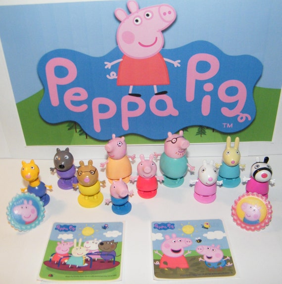 A plastic Peppa Pig toy play house standing on a table Stock Photo