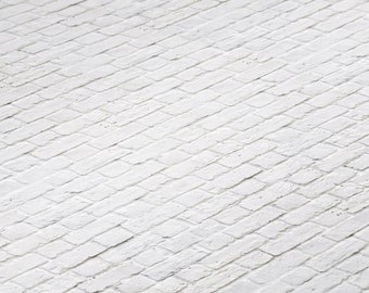 May include: White brick wall with a diagonal pattern. The bricks are arranged in a herringbone pattern.