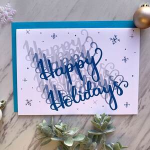 Tarjeta de felices fiestas: tarjeta de temporada y tarjeta de felicitación navideña de saludos de invierno