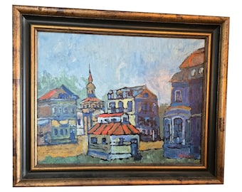 Pode incluir: Uma pintura a óleo emoldurada que retrata uma cidade colorida com edifícios em vários tons de azul, vermelho e amarelo. A pintura tem um estilo de pinceladas texturizadas e uma moldura dourada rústica.