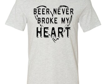 May include: A heather grey t-shirt with a black graphic that reads "Beer Never Broke My Heart" in a stylized heart shape.