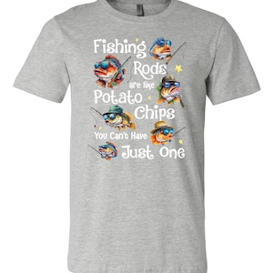 May include: Gray t-shirt with a graphic of cartoon fish wearing sunglasses and holding fishing rods. The text reads "Fishing Rods are like Potato Chips You Can't Have Just One."